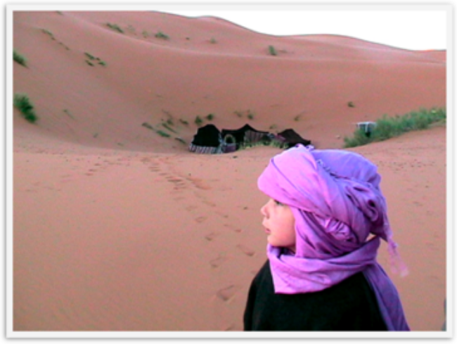 Mozart deep in the Sahara in Morocco at sunrise waking up after camel trek over night Mozart deep in the Sahara in Morocco at sunrise waking up after camel trek over night