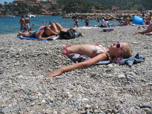 Family travel France, kid buried in sand Family travel France, kid buried in sand