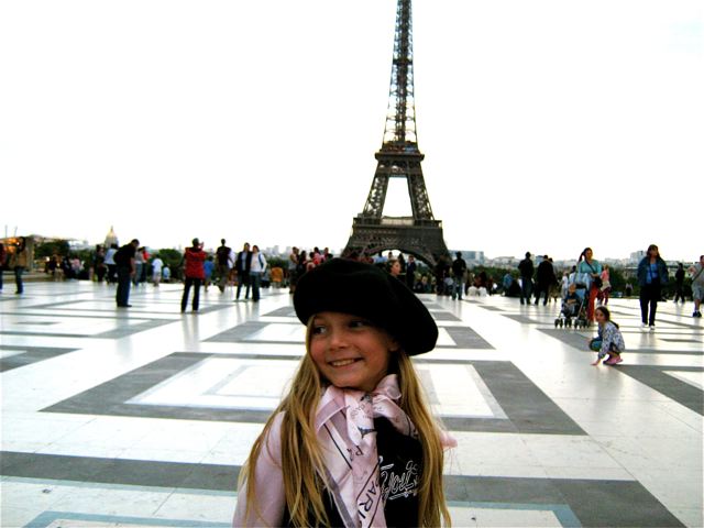 Tween at Eiffel Tower, family travel Paris, beret & scarf souvenirs Tween at Eiffel Tower, family travel Paris, beret & scarf souvenirs