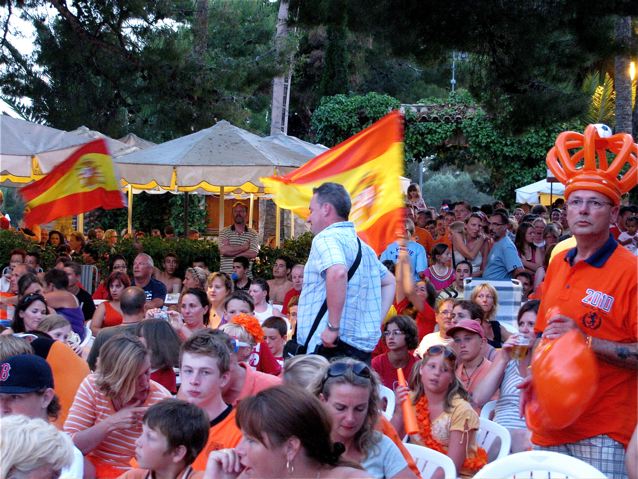 world cup celebrating crowd in Barcelona with Dutch in orange, Spaniards in red world cup celebrating crowd in Barcelona with Dutch in orange, Spaniards in red