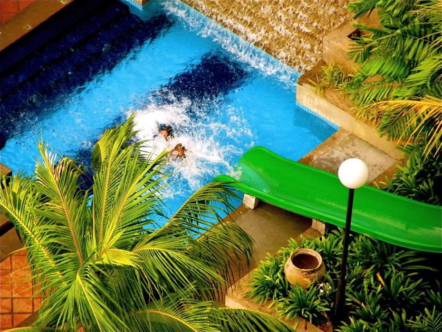 playing with friends in Penang resort water slide playing with friends in Penang resort water slide
