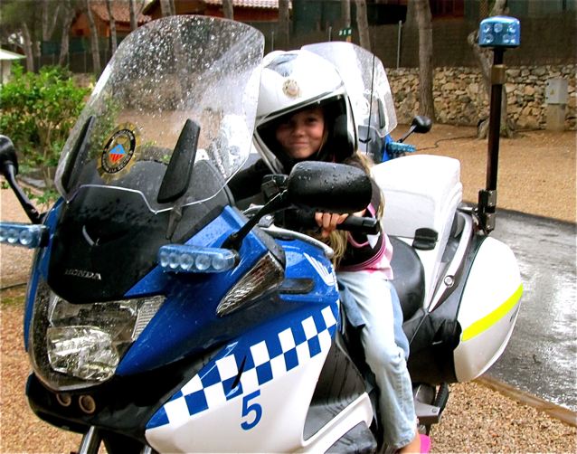 chica rides a policia bike in Barcelona