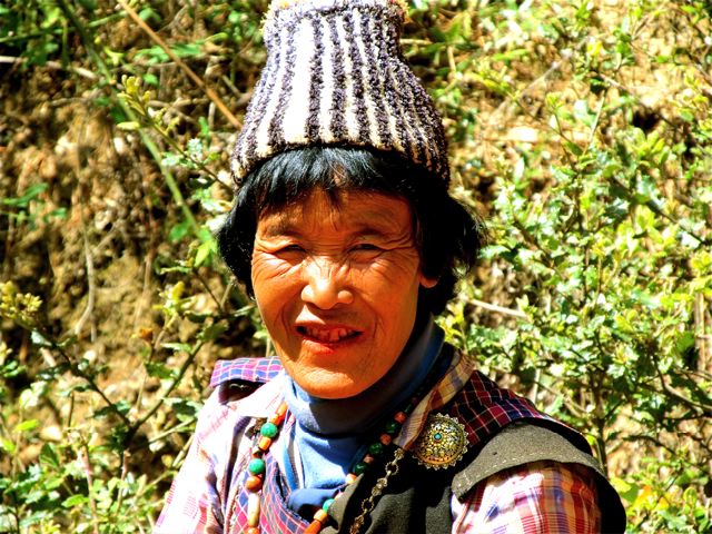 Bhutan woman with "doma" red smile from beetlenut/lime treats Bhutan woman with "doma" red smile from beetlenut/lime treats