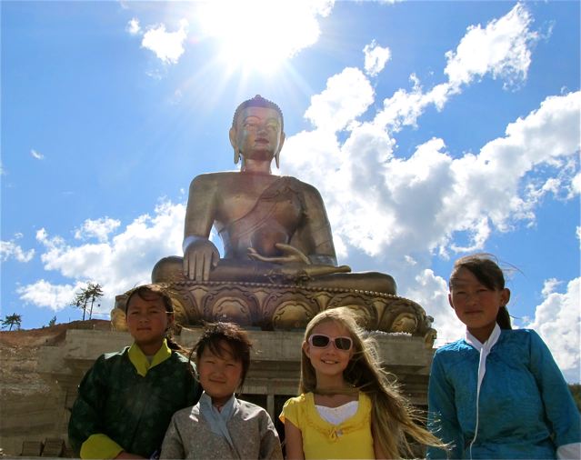 meeting friends near giant buddha in Bhutan meeting friends near giant buddha in Bhutan