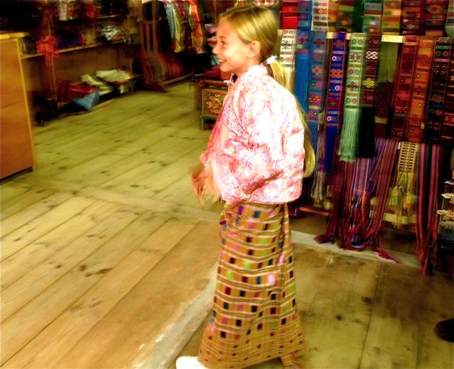 our girl in Bhutan trying on the elegant traditonal Bhutanese dress called Kiras our girl in Bhutan trying on the elegant traditonal Bhutanese dress called Kiras
