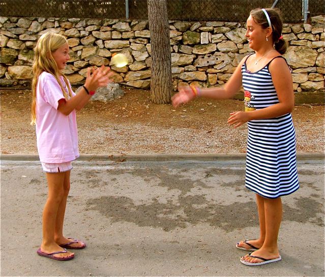Two Spanish speaking Tweens playing with water balloon in Spain Two Spanish speaking Tweens playing with water balloon in Spain