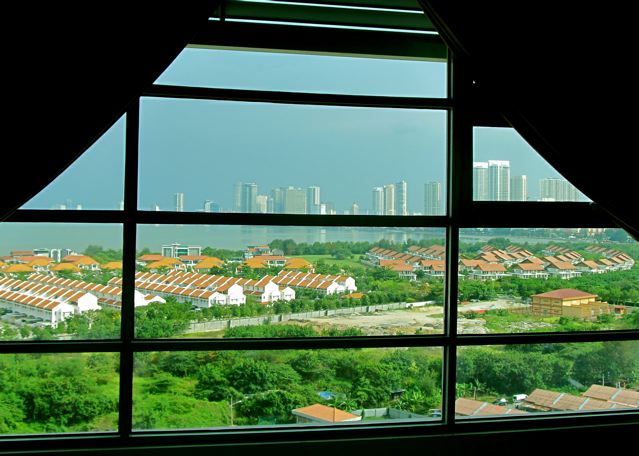 Sea, cityscape, tile roof and green space views in Penang Sea, cityscape, tile roof and green space views in Penang