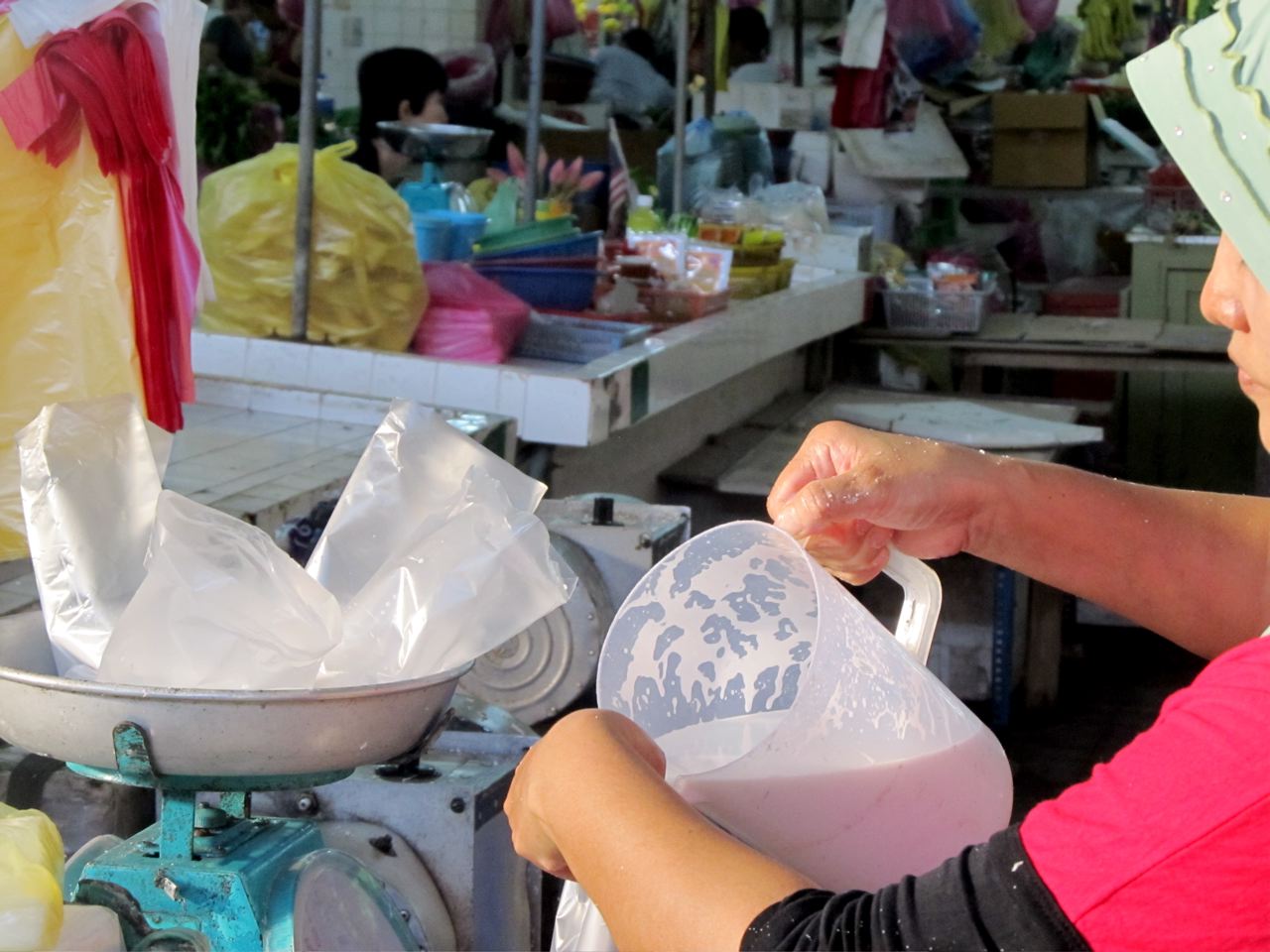 pouring fresh coconut milk in Asia pouring fresh coconut milk in Asia