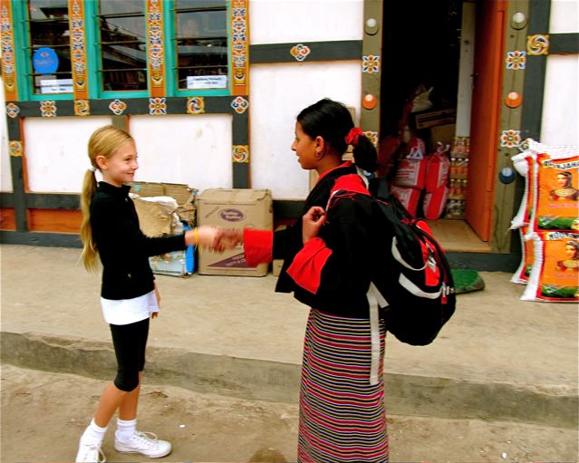 world traveling family making friends in Bhutan world traveling family making friends in Bhutan