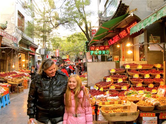 Mom and daughter shopping in China trip at Xian Muslim Quarter Mom and daughter shopping in China trip at Xian Muslim Quarter