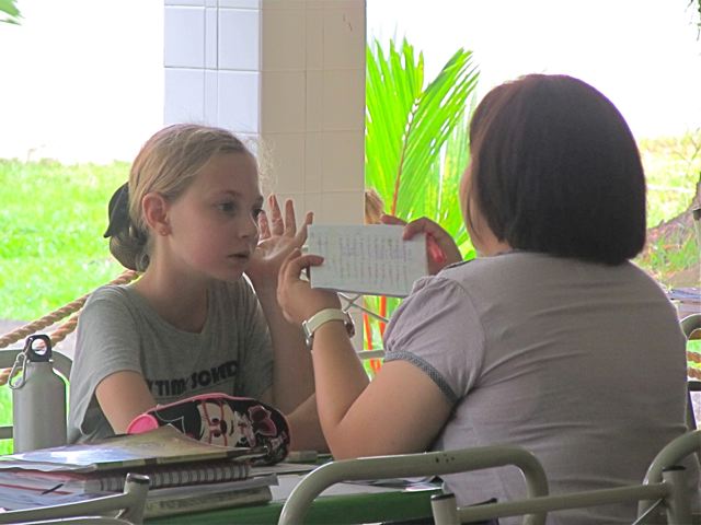Doing after school tutoring with her Chinese teacher at her Mandarin shool in Asia - an American doing the Asian tuition route to raise scores and help learning Doing after school tutoring with her Chinese teacher at her Mandarin shool in Asia - an American doing the Asian tuition route to raise scores and help learning