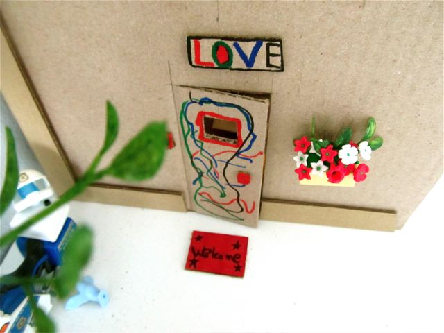 the door to her kids doll house she painted love and welcome the door to her kids doll house she painted love and welcome