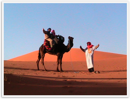 Father and 6 year old daughter doing a camel trek in the Sahara Father and 6 year old daughter doing a camel trek in the Sahara