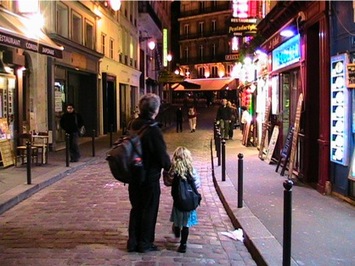 Backpacking dad and daughter exploring Paris at night Backpacking dad and daughter exploring Paris at night