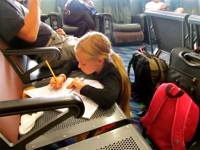 My kid working on writing Chinese at an airport...I think Bangkok headed to Bhutan My kid working on writing Chinese at an airport...I think Bangkok headed to Bhutan