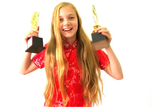 American girl wins two trophies for winning Chinese and English eloction contests American girl wins two trophies for winning Chinese and English eloction contests