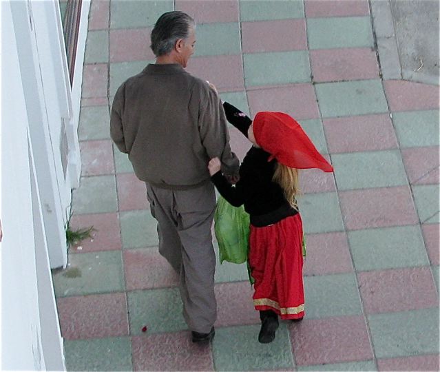Daddy walking his daughter to school in Spain Daddy walking his daughter to school in Spain