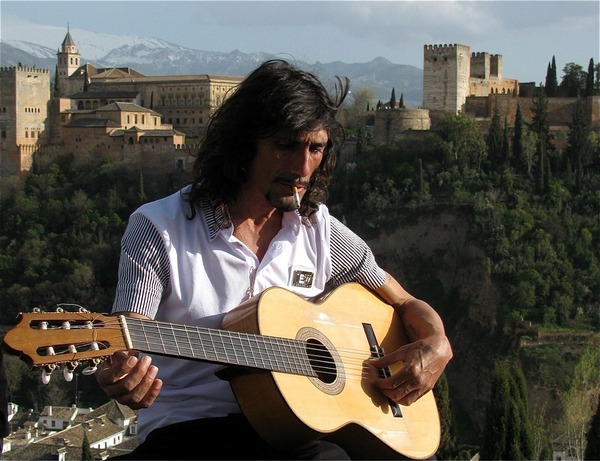 Stunning photo of the Alhambra in Granada with gypsy guitar Stunning photo of the Alhambra in Granada with gypsy guitar