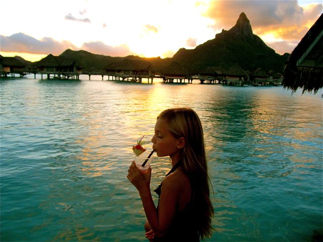 world's Most Well-Traveled Child - sipping tropical drink in Bora Bora sunset world's Most Well-Traveled Child - sipping tropical drink in Bora Bora sunset