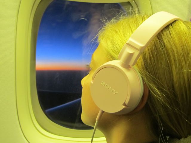 World's most traveled child watching a sunset from her plane window after leaving Beijing World's most traveled child watching a sunset from her plane window after leaving Beijing
