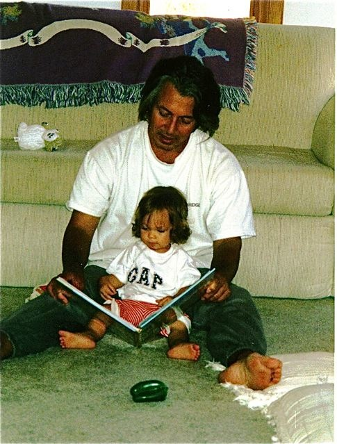 learning a second language as a baby, daddy reading in Spanish to his baby