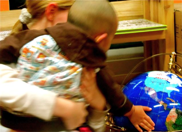 American girl, Chinese baby with globe in China