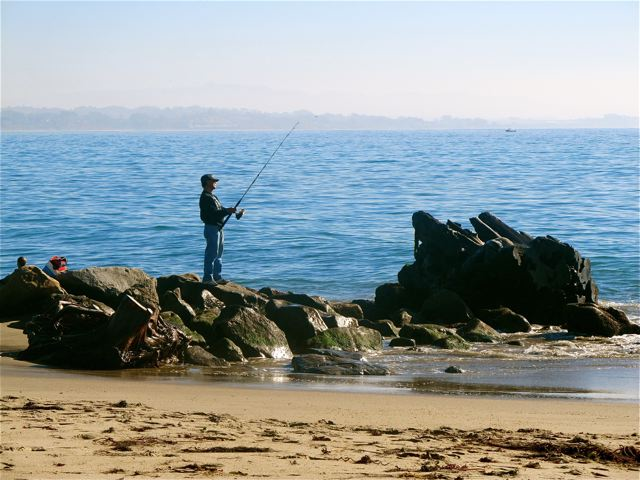watching people  fishing on the rocks at California  beach