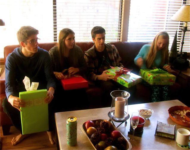 teens opening presents on Christmas morning