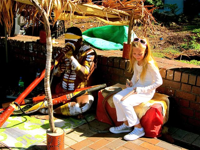 world traveling kid Mozart jamming with Aboriginal friend in Australia in full ceremonial paint world traveling kid Mozart jamming with Aboriginal friend in Australia in full ceremonial paint