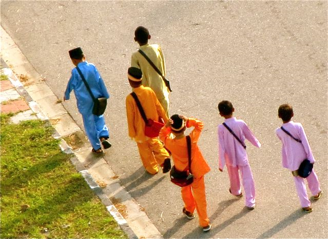 Asia Dream - colorful school boys in Asia dresses for a holiday celebration Asia Dream - colorful school boys in Asia dresses for a holiday celebration
