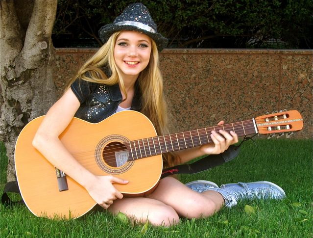 Travel teen singer Mozart learning guitar 