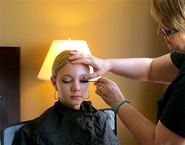 teen getting professional makeup done teen getting professional makeup done