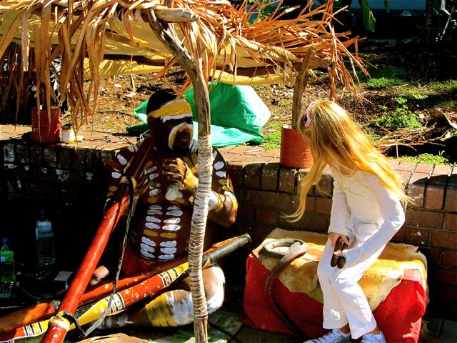 travel kid Mozart about to jam one on one with Aboriginal didge player in ceremonial paint in Sydney travel kid Mozart about to jam one on one with Aboriginal didge player in ceremonial paint in Sydney