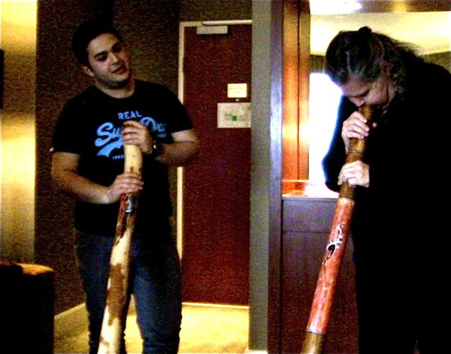 Gifts of the Quay store owner teaching didgeridoo Gifts of the Quay store owner teaching didgeridoo
