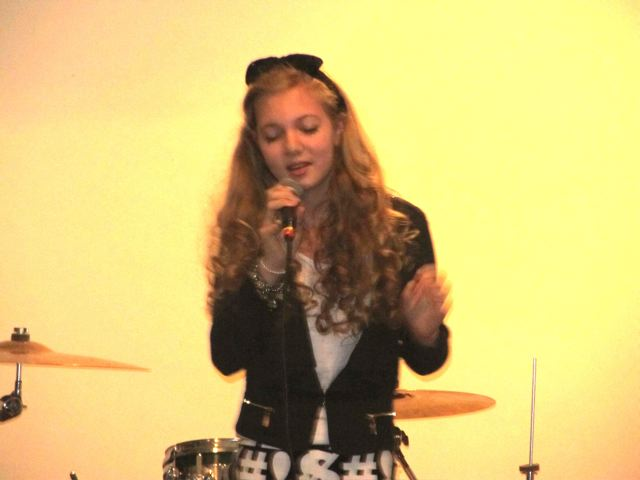 Musical travel teen Mozart singing at a popular venue 