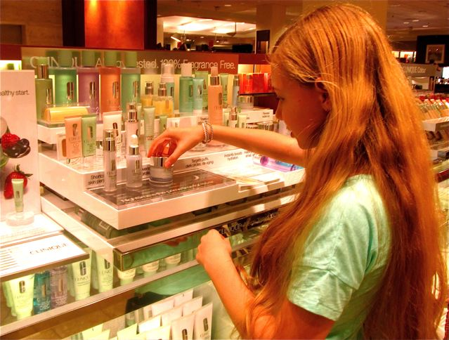 RTW travel teen checking out the make up and beauty products at clinique RTW travel teen checking out the make up and beauty products at clinique