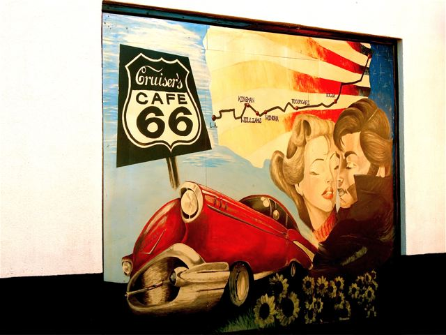 US Route 66 with map, sign and art