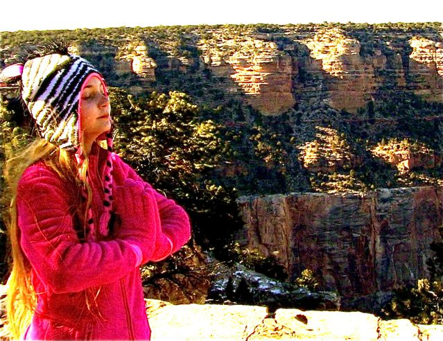 Inspiring travel teen Mozart meditating and saying a prayer at Grand Canyon Inspiring travel teen Mozart meditating and saying a prayer at Grand Canyon