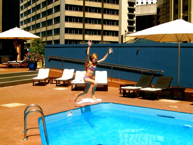 kid jumping for joy at Four Seasons Sydney rooftop pool kid jumping for joy at Four Seasons Sydney rooftop pool