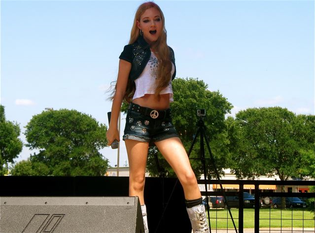 Travel teen singer mozart sings at the Gas Monkey Bar n Grill in Dallas