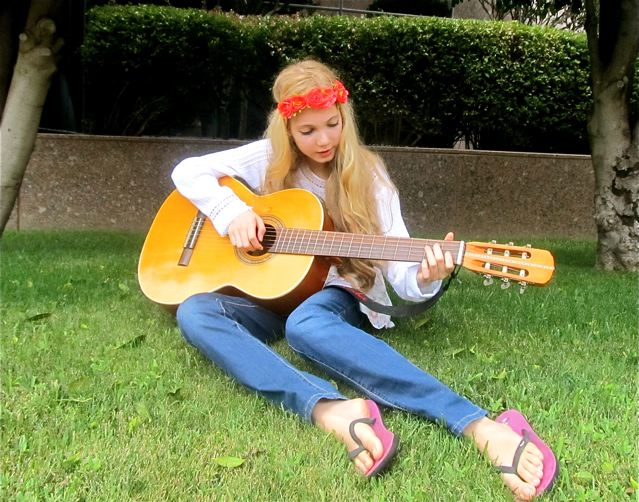 Beautiful singer Mozart playing her guitar and writing a song Beautiful singer Mozart playing her guitar and writing a song