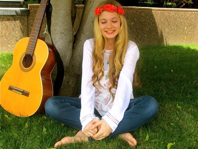 Blissful Mozart with her guitar in nature Blissful Mozart with her guitar in nature