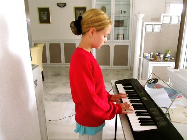 travel kid Mozart practicing piano in Asia travel kid Mozart practicing piano in Asia