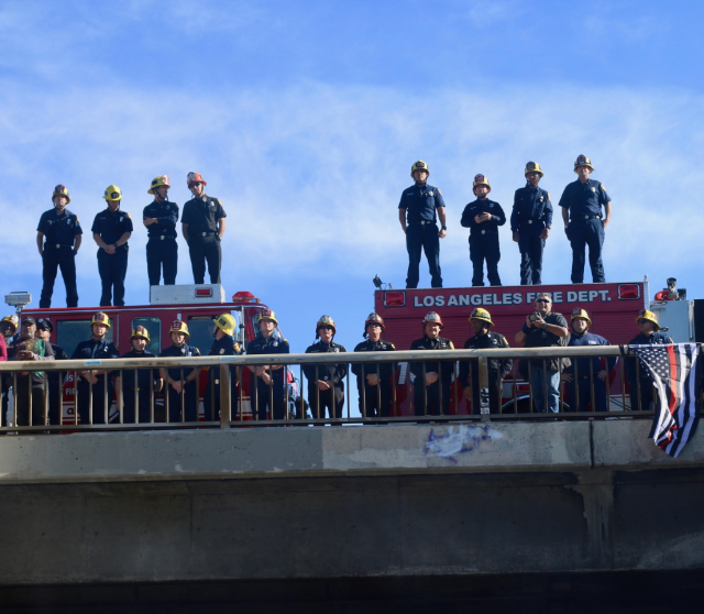 firemen honoring process for firefighter Cory Iverson firemen honoring process for firefighter Cory Iverson