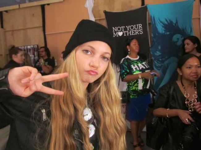 Trlingual teen singer and youtuber Mozart giving the peace sign at New York Fashion Week backstage Trlingual teen singer and youtuber Mozart giving the peace sign at New York Fashion Week backstage