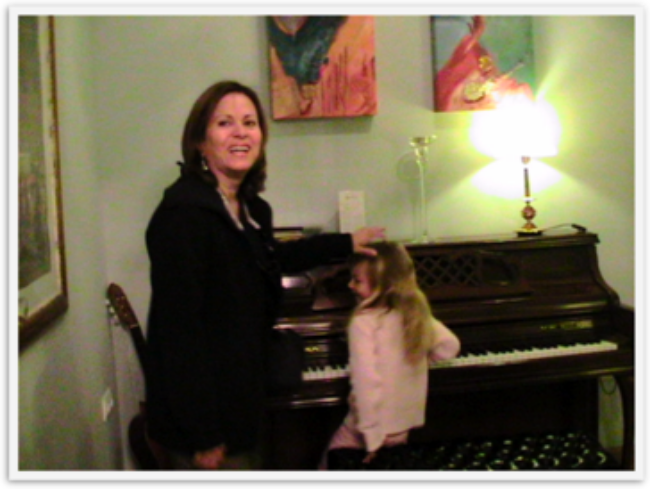 Pretty Mozart playing at Armadeus hotel in Seville on their piano for her aunt Pretty Mozart playing at Armadeus hotel in Seville on their piano for her aunt