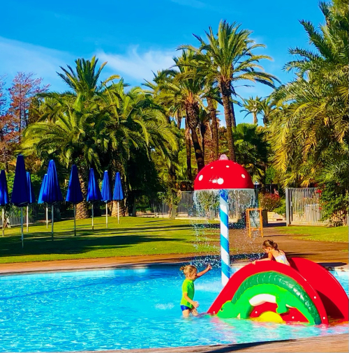 Fall Color & Halloween in Barcelona! kids play pool late october sun